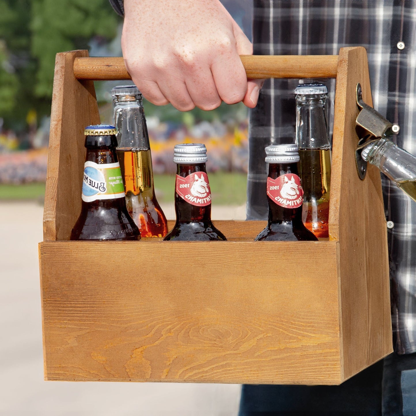 A male model carrying the 6-Bottle Carrier with Built-in Opener