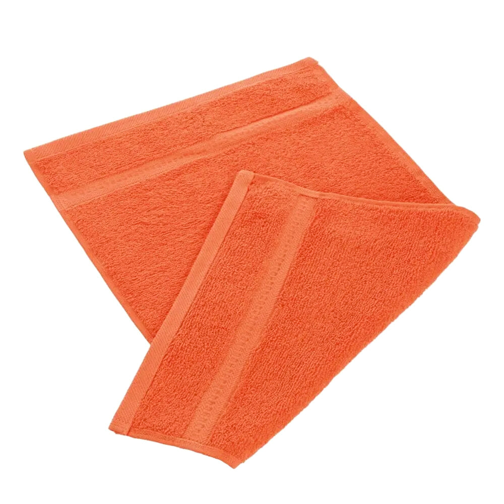 Orange egyptian cotton 550gsm manicure guest towel on white background