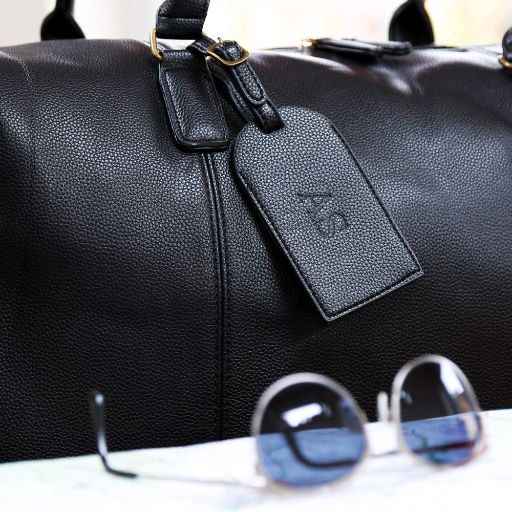 Closeup of the black Personalised Luggage Tag with plain debossing