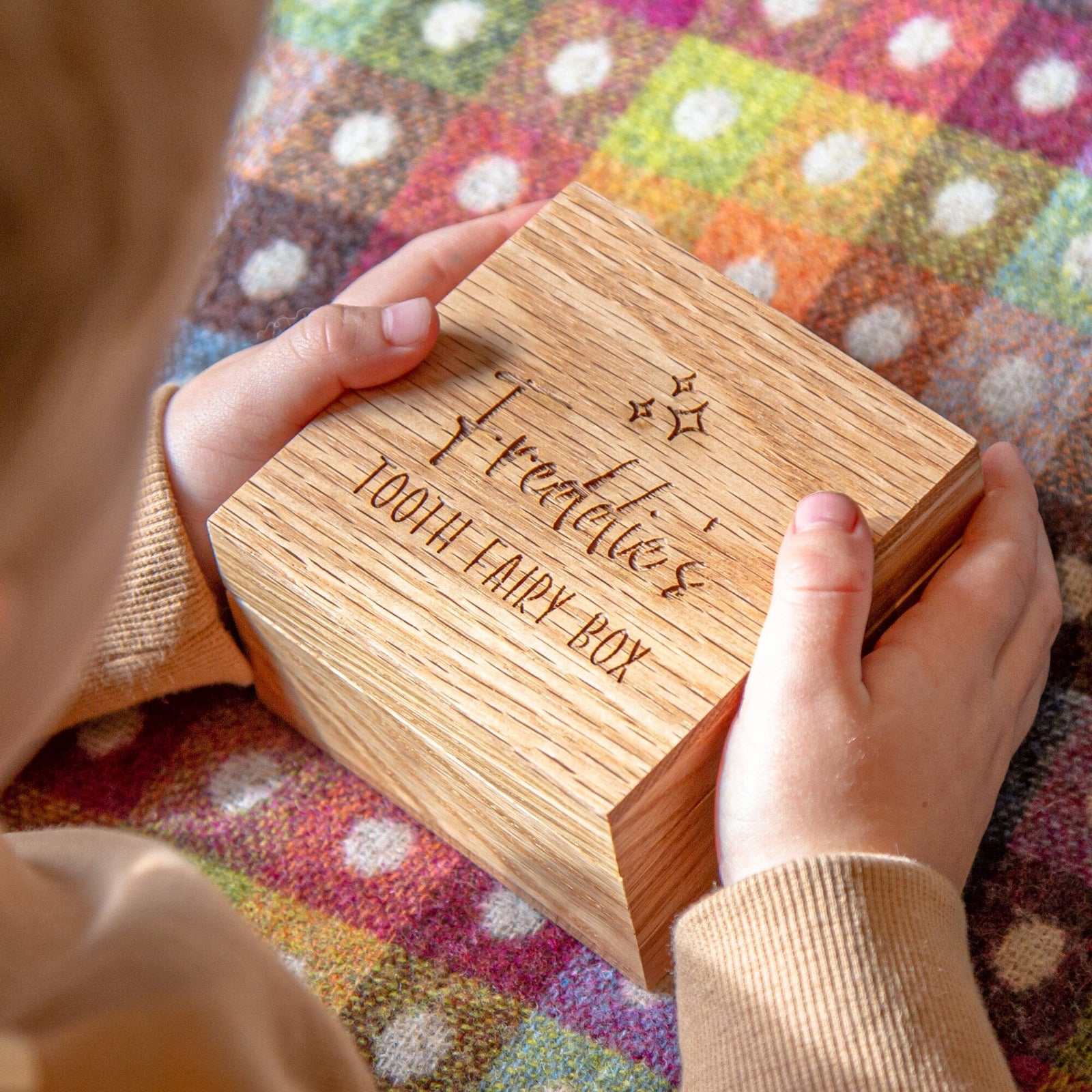 A kid opening the Personalised Oak Tooth Fairy Box