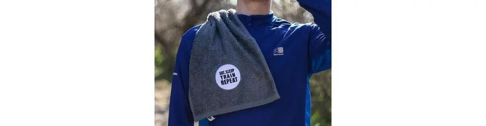 gym towel with eat, sleep, train repeat embroidered design