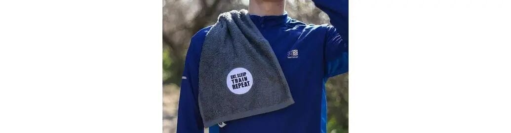 gym towel with eat, sleep, train repeat embroidered design