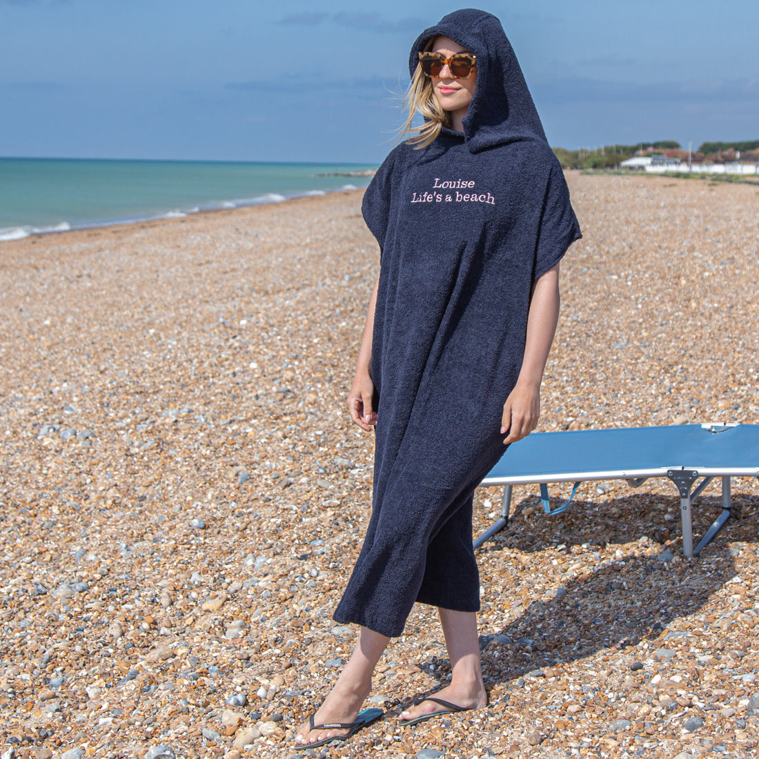 woman wearing personalised changing robe at the beach