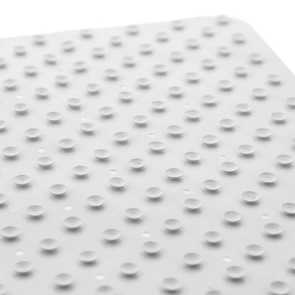 Suction cups of white anti-fungal rubber shower mat on white backdrop