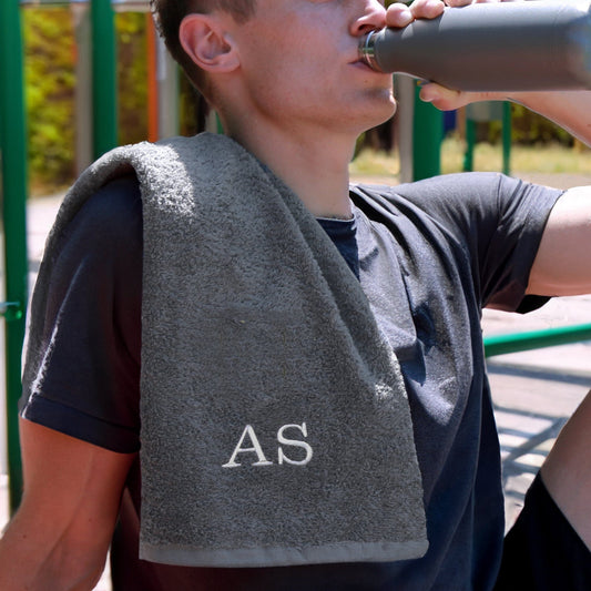 Persoanlised slate gym towel outdoor gym male model drinking water