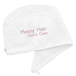 White Luxury Hair Towel with Messy Hair Don't Care Logo on a white backdrop