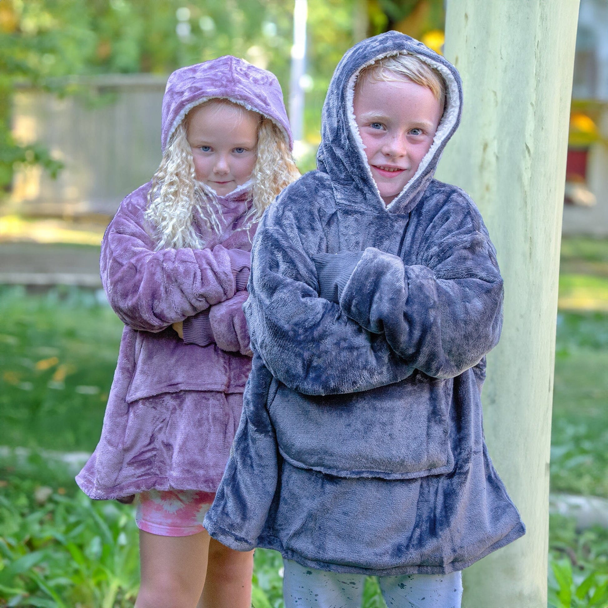 Two Kids wearing Hooded Sherpa Ponchos