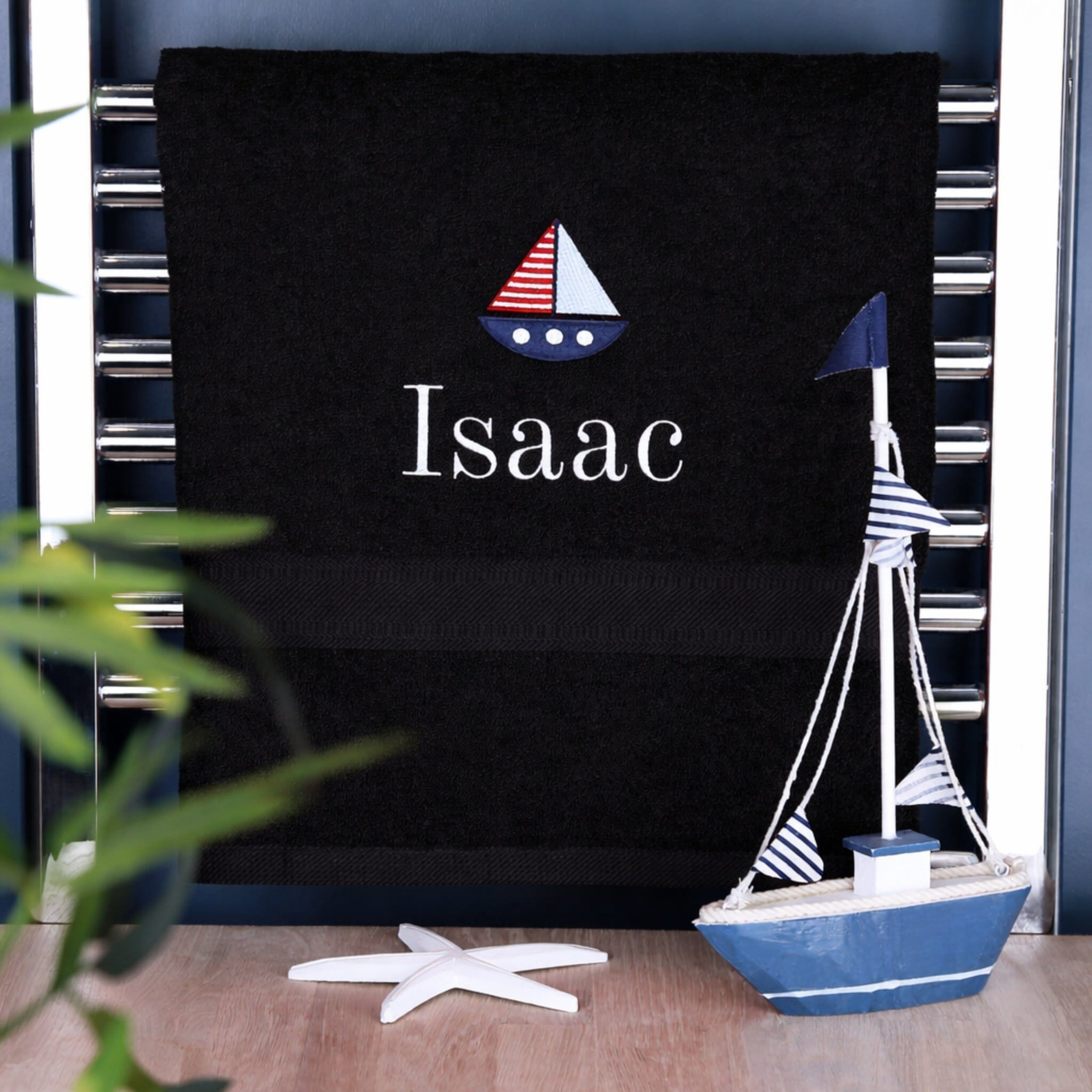 boys name on black bath towel