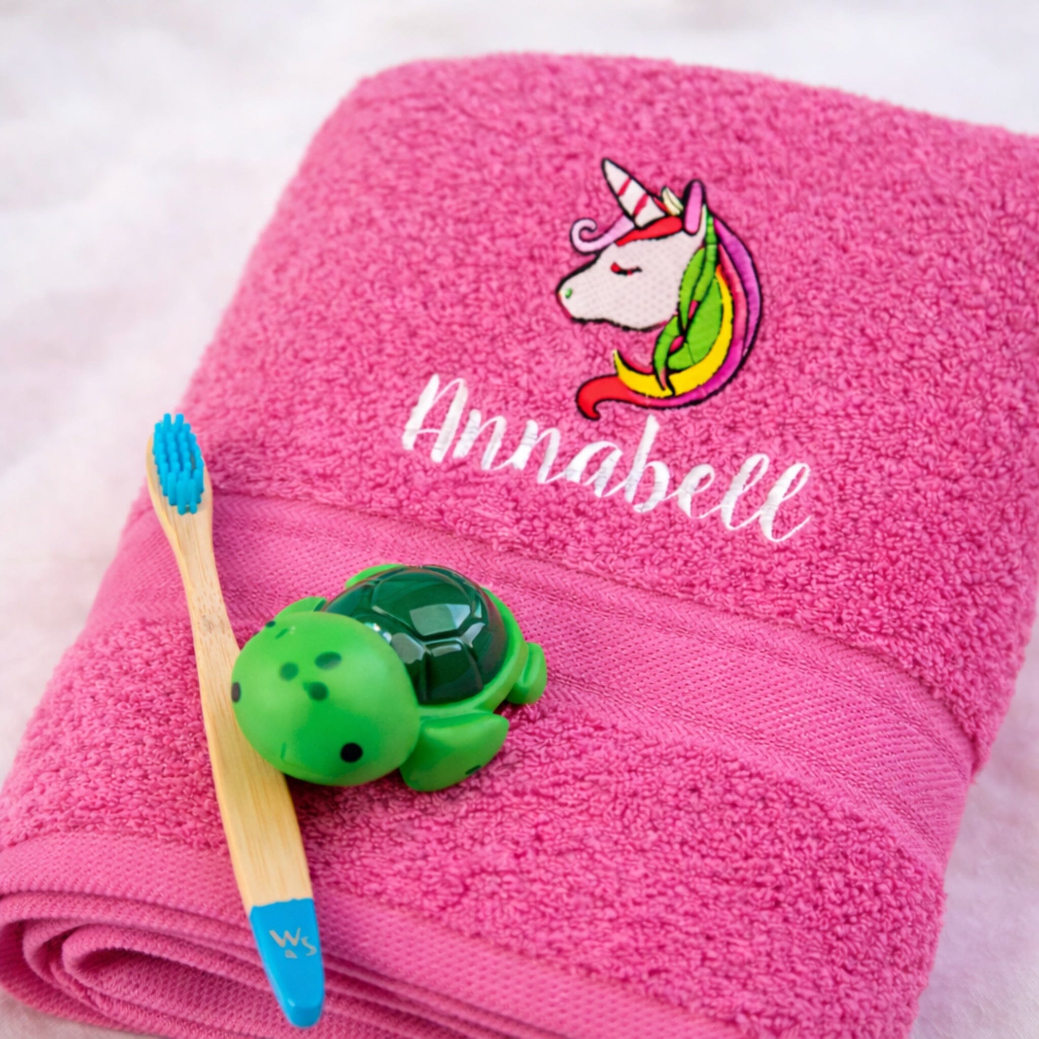 name on pink bath towel