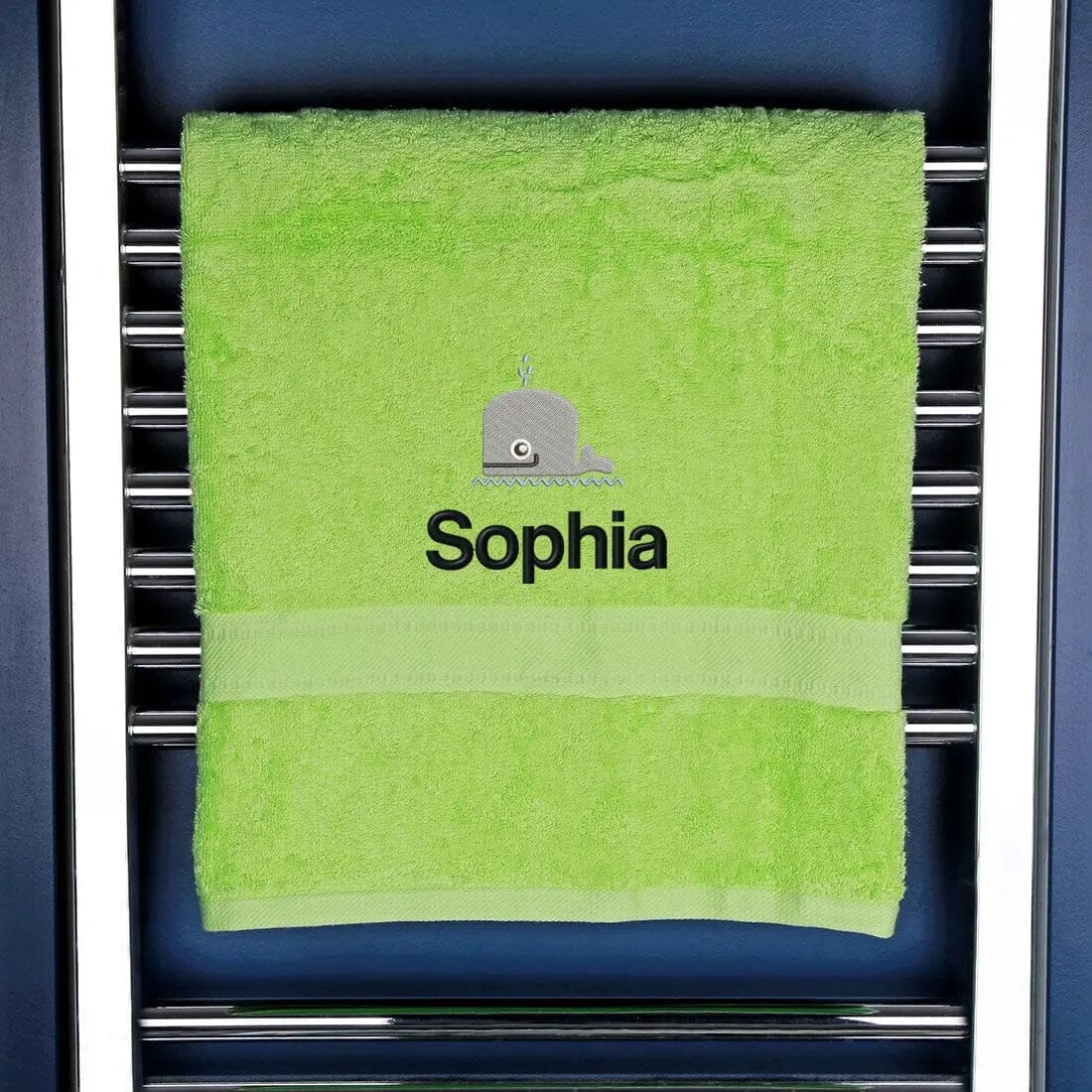whale and name embroidered onto a green towel