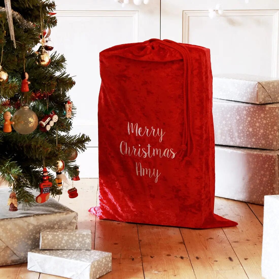 Christmas Gift Sack next to a christmass tree