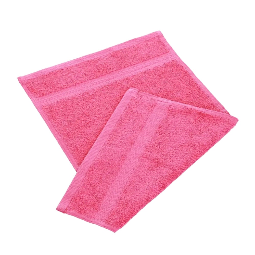Pink egyptian cotton 550gsm manicure guest towel on white background