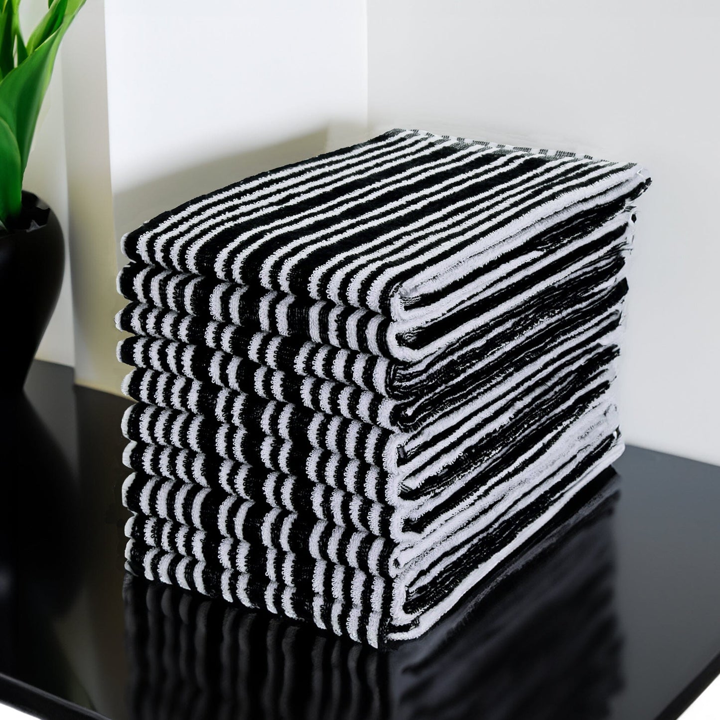 Hairdressing/Salon Tinting Towels, Pack of 12  on a shelf in a salon