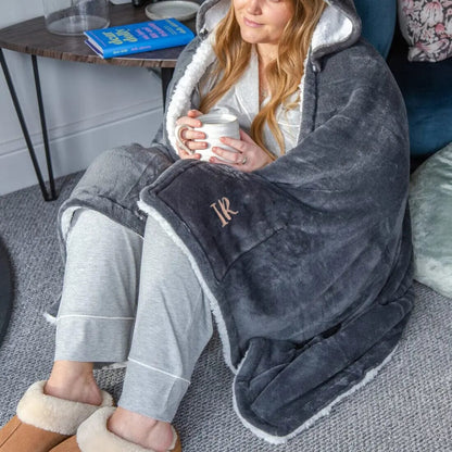 A female model wearing Personalised Hooded Sherpa Blanket