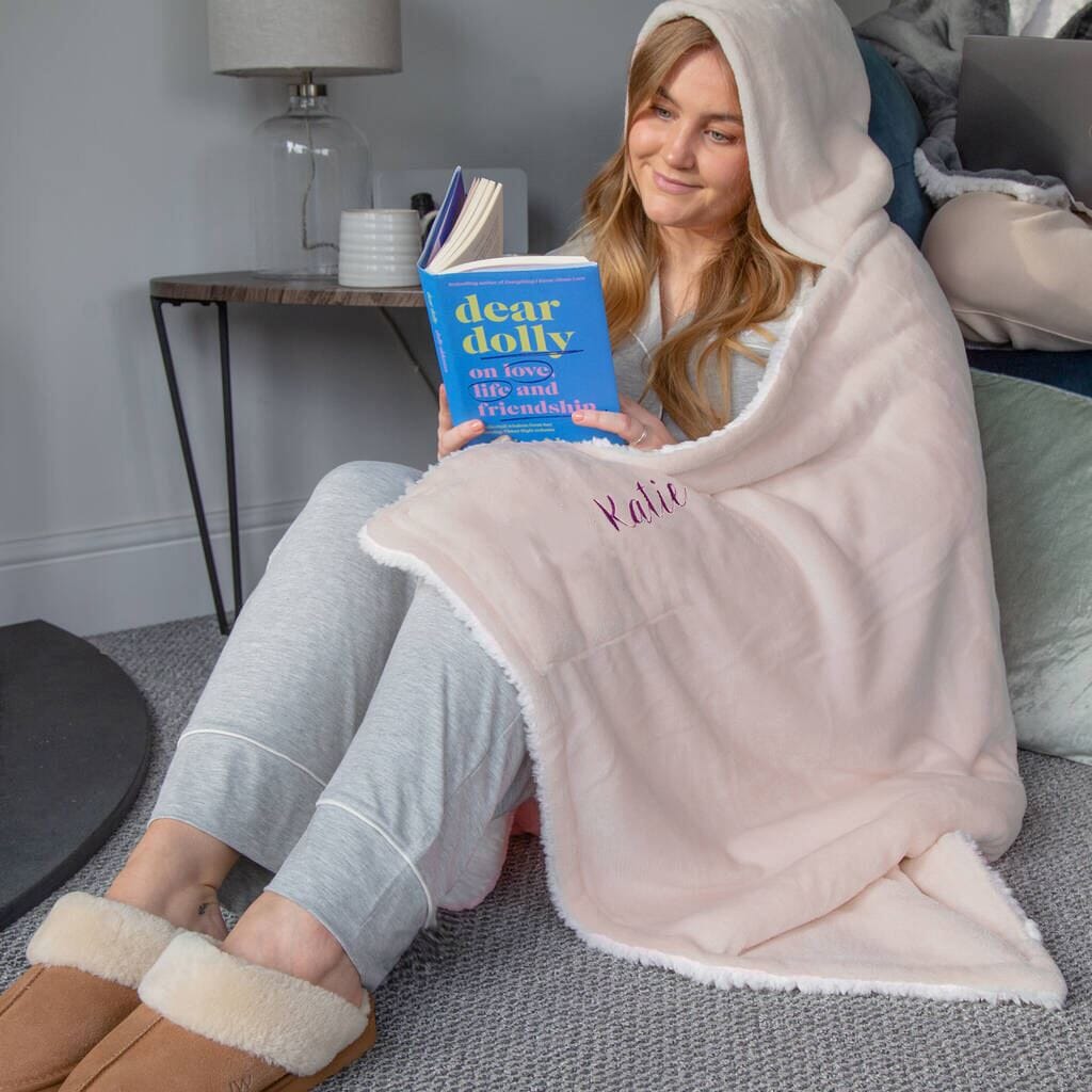 A female model wearing Personalised Hooded Sherpa Blanket