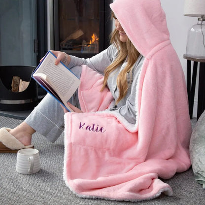 A female model wearing Personalised Pink Hooded Sherpa Blanket