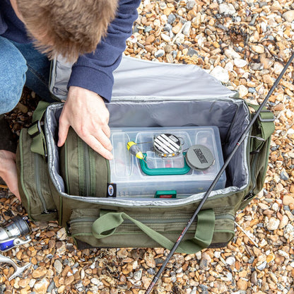 Open fishing bag on the beach