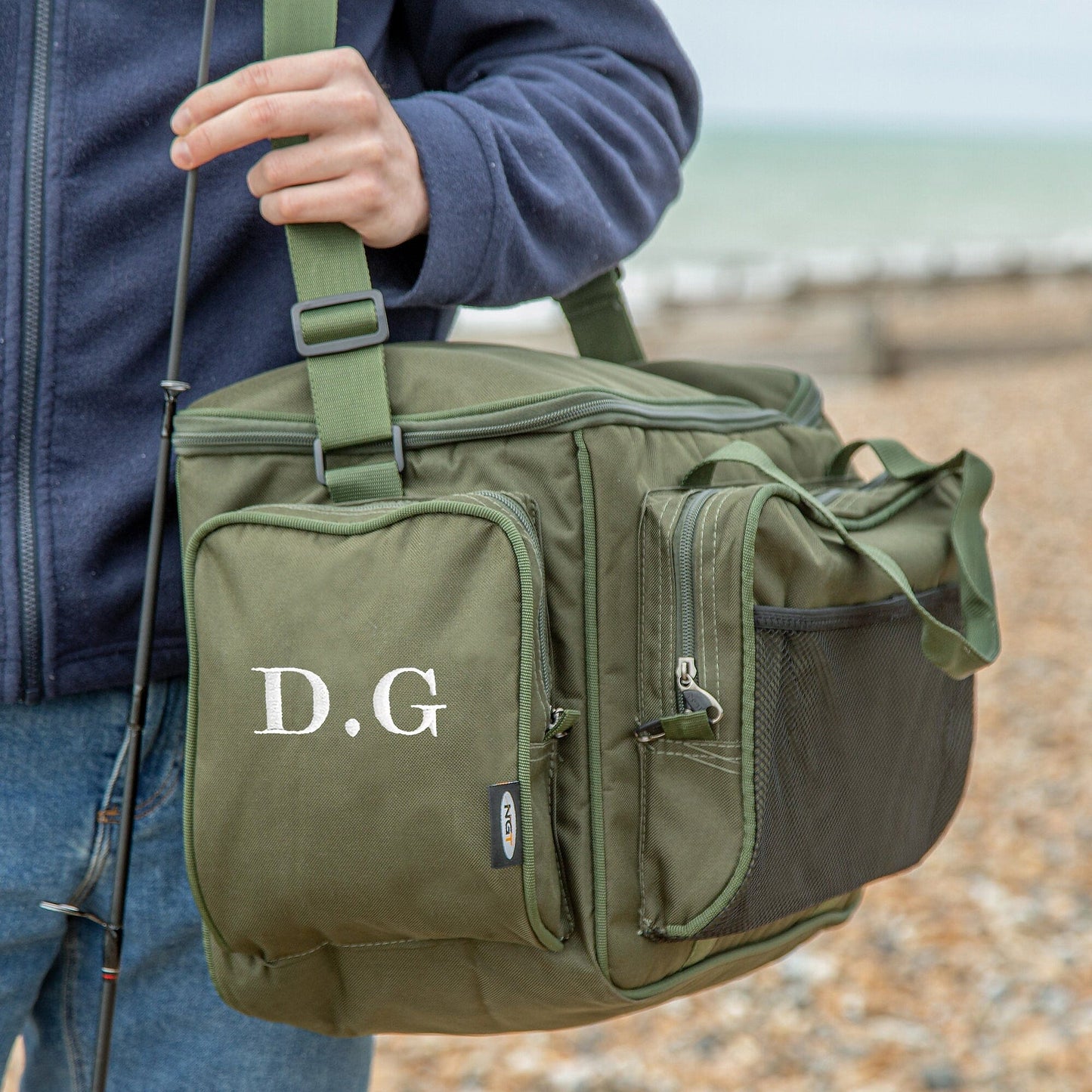 Personalised insulated fishing carry bag on the beach