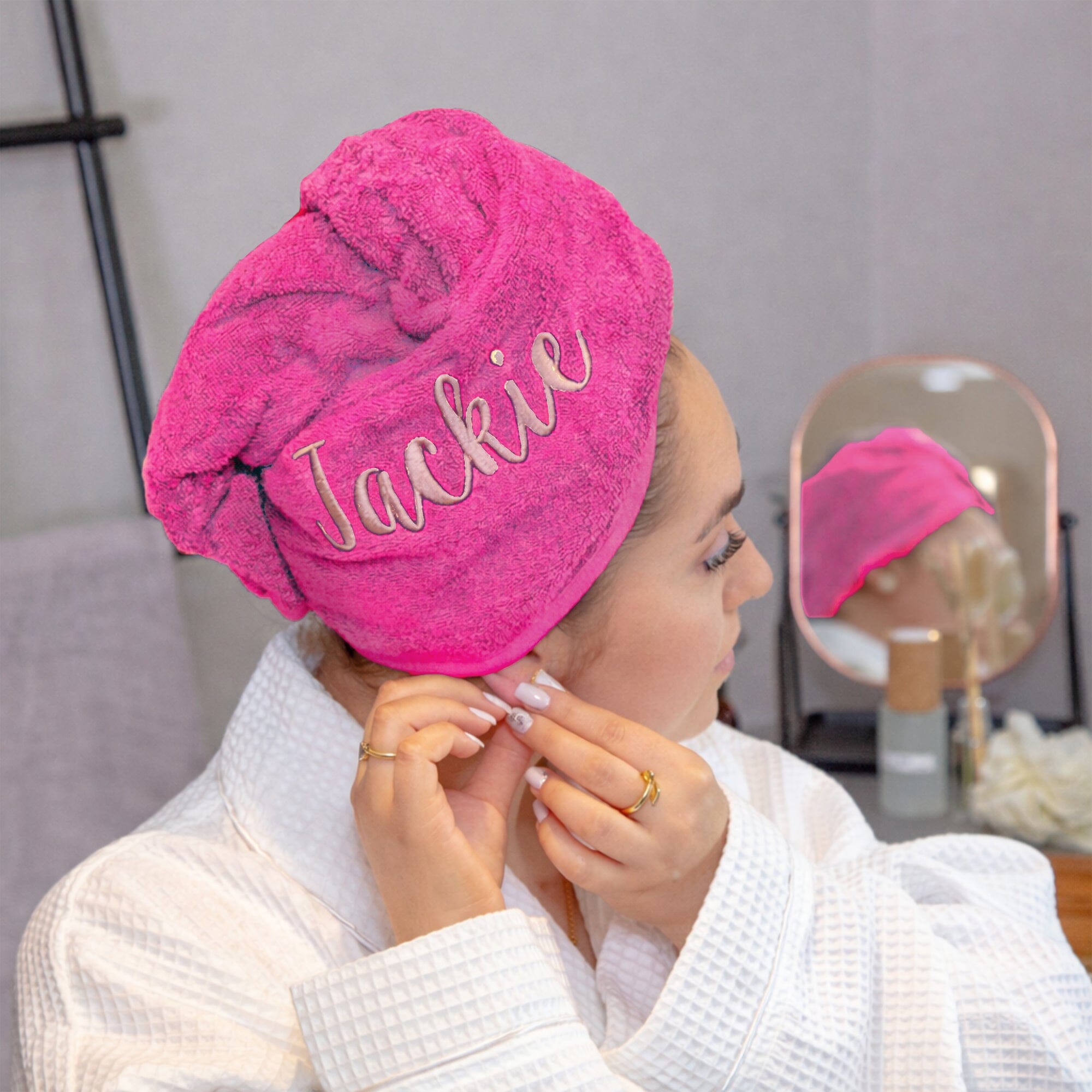 Rose coloured thread on pink hair towel