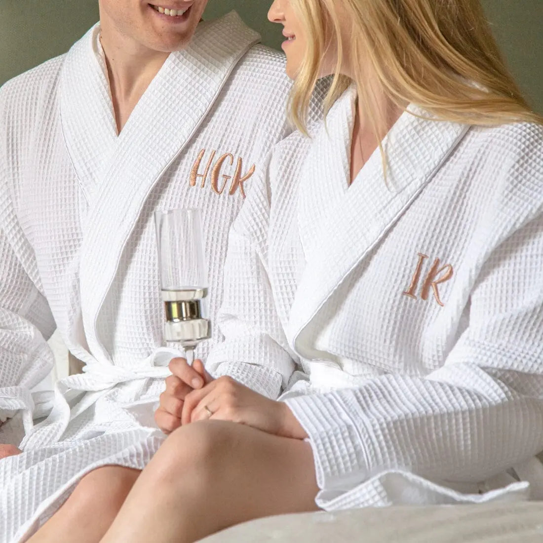 lifestyle shot of a couple wearing the robes