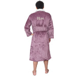 Person wearing a personalised sherpa robe with 'Mine' text on a white background
