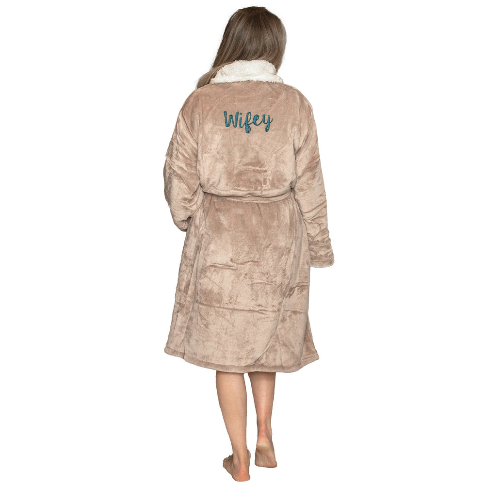 Woman wearing a Personalised Taupe Sherpa robe with 'Wifey' embroidery on a white background