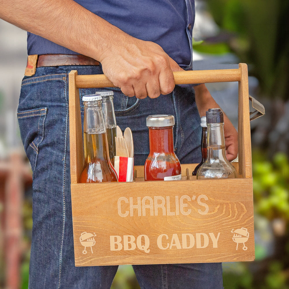 A male model carrying a Personalised Barbecue Condiment Holder outdoor