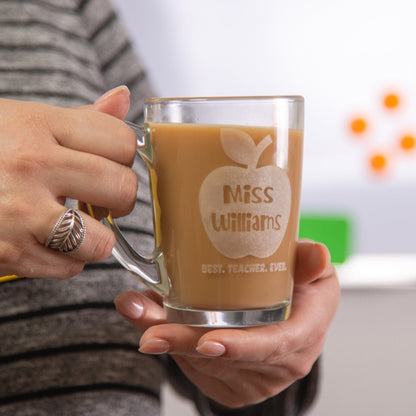 A teacher holding a Personalised Best Teacher Ever Glass Mug 