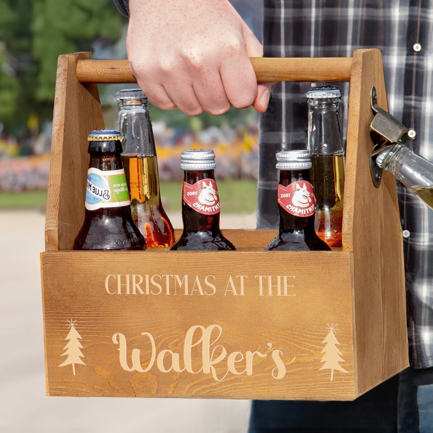 A male model carrying the Personalised Christmas Wooden Caddy