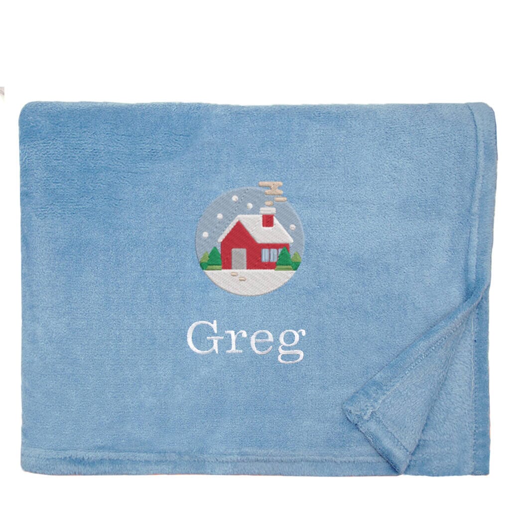 Blue Personalised Cosy Christmas Snuggle Touch Blanket With Embroidered Festive Cottage Design on White Backdrop