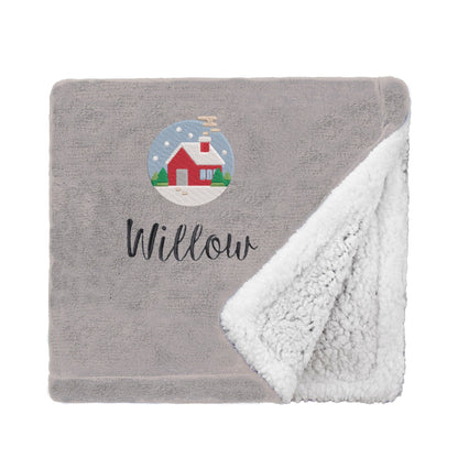 Taupe Personalised Cosy Christmas Mini Sherpa Blanket With Embroidered Festive Cottage Design On White Backdrop