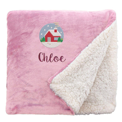 Pink Personalised Cosy Christmas Sherpa Blanket With Embroidered Festive Cottage Design On White Backdrop