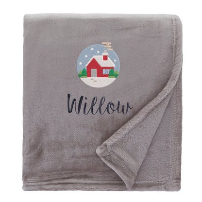 Natural Personalised Cosy Christmas So Soft Blanket With Embroidered Festive Cottage Design On White Backdrop