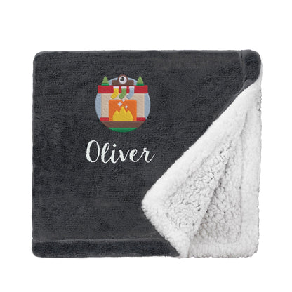 Black Personalised Cosy Christmas Mini Sherpa Blanket With Embroidered Winter Fireplace Design On White Backdrop