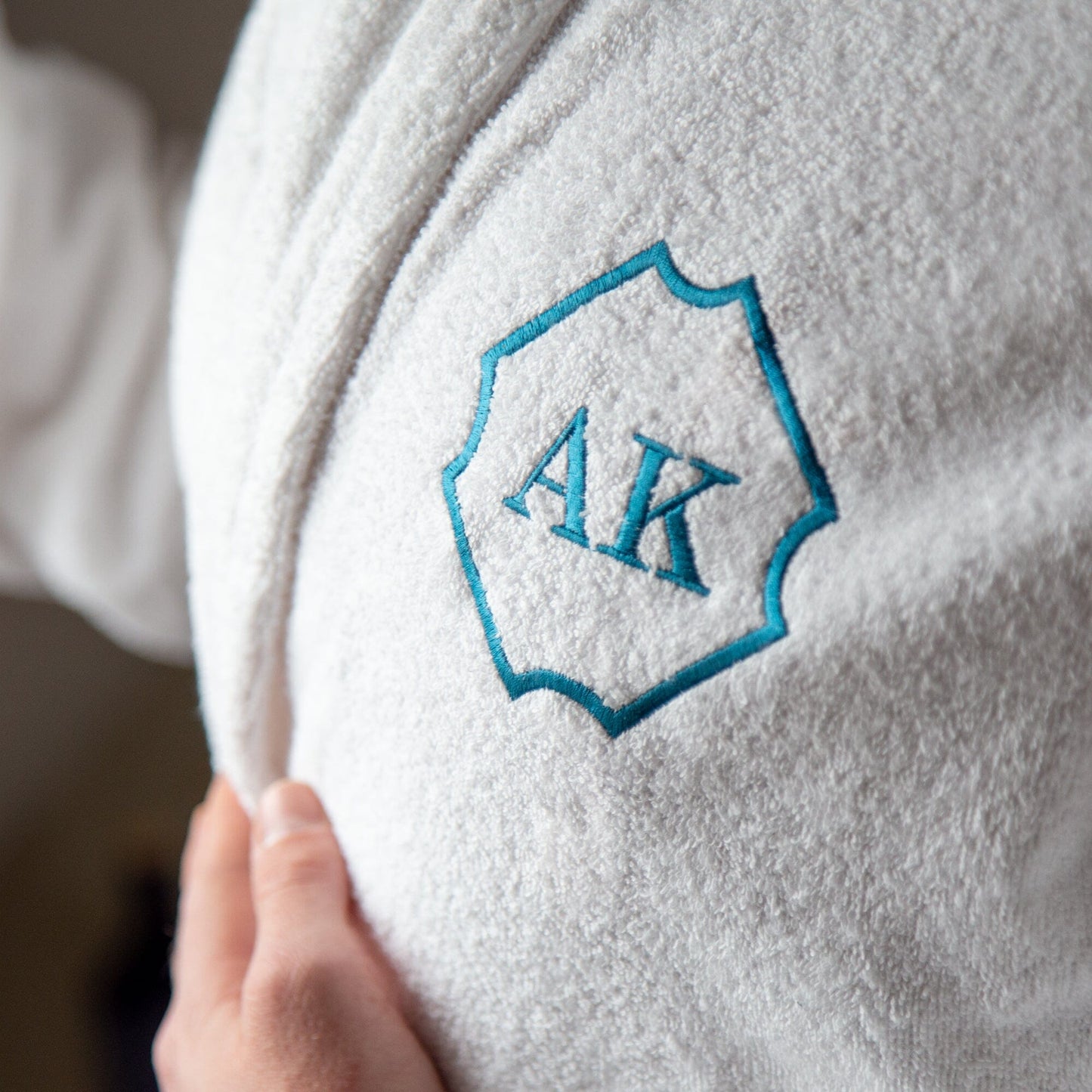 a close up of a white personalised bathrobe