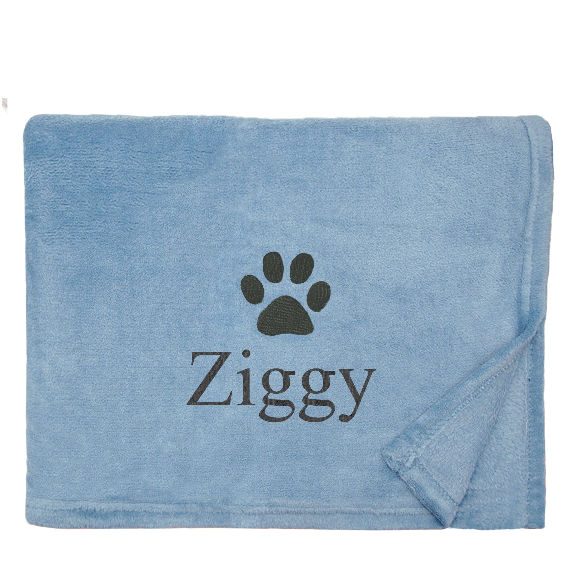 Blue Dog Throw with a pawprint design and personalisation of 'Ziggy'
