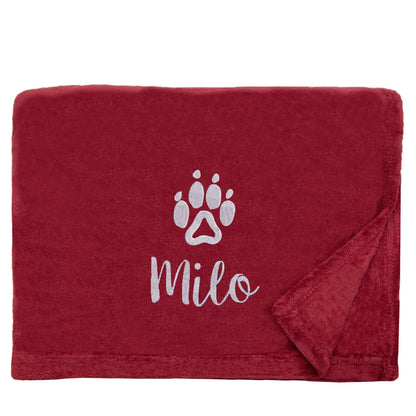 Dog Throw with a pawprint design and personalisation of 'Milo'