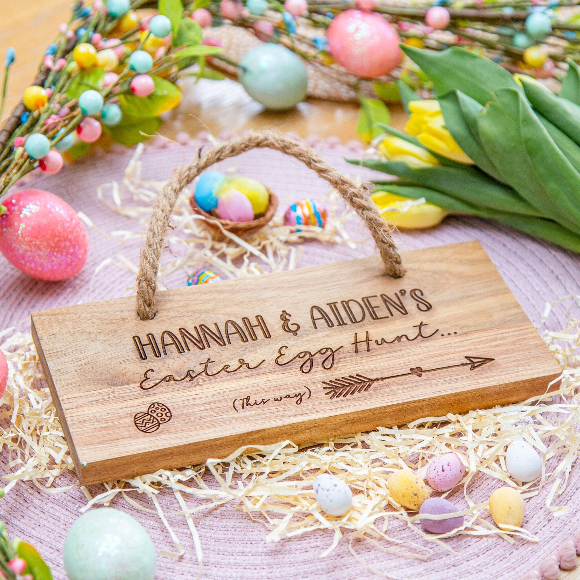 Personalised Easter Egg Hunt Wooden Sign on the table with easter props