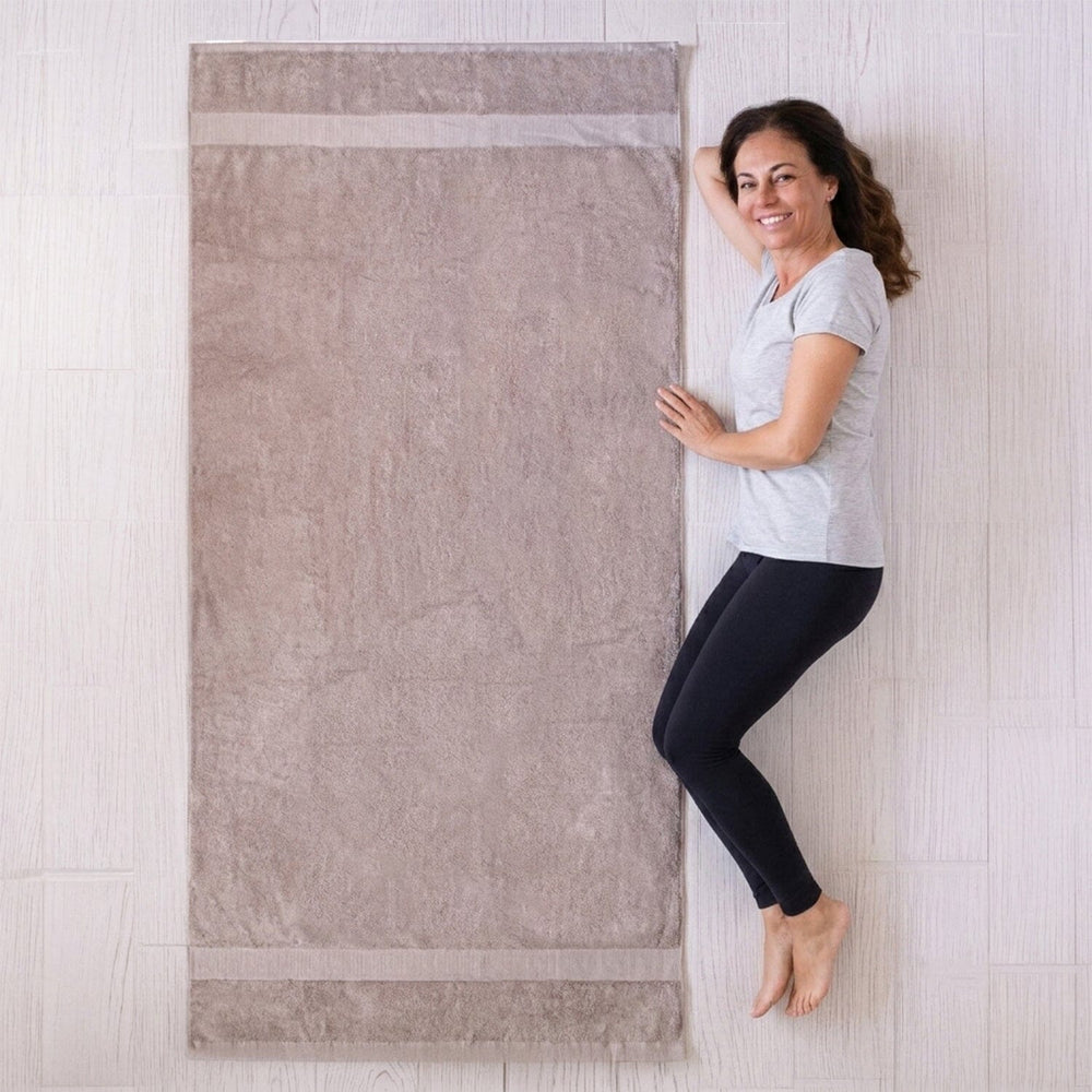 infographic showing the scale of the towel compared to an adult female