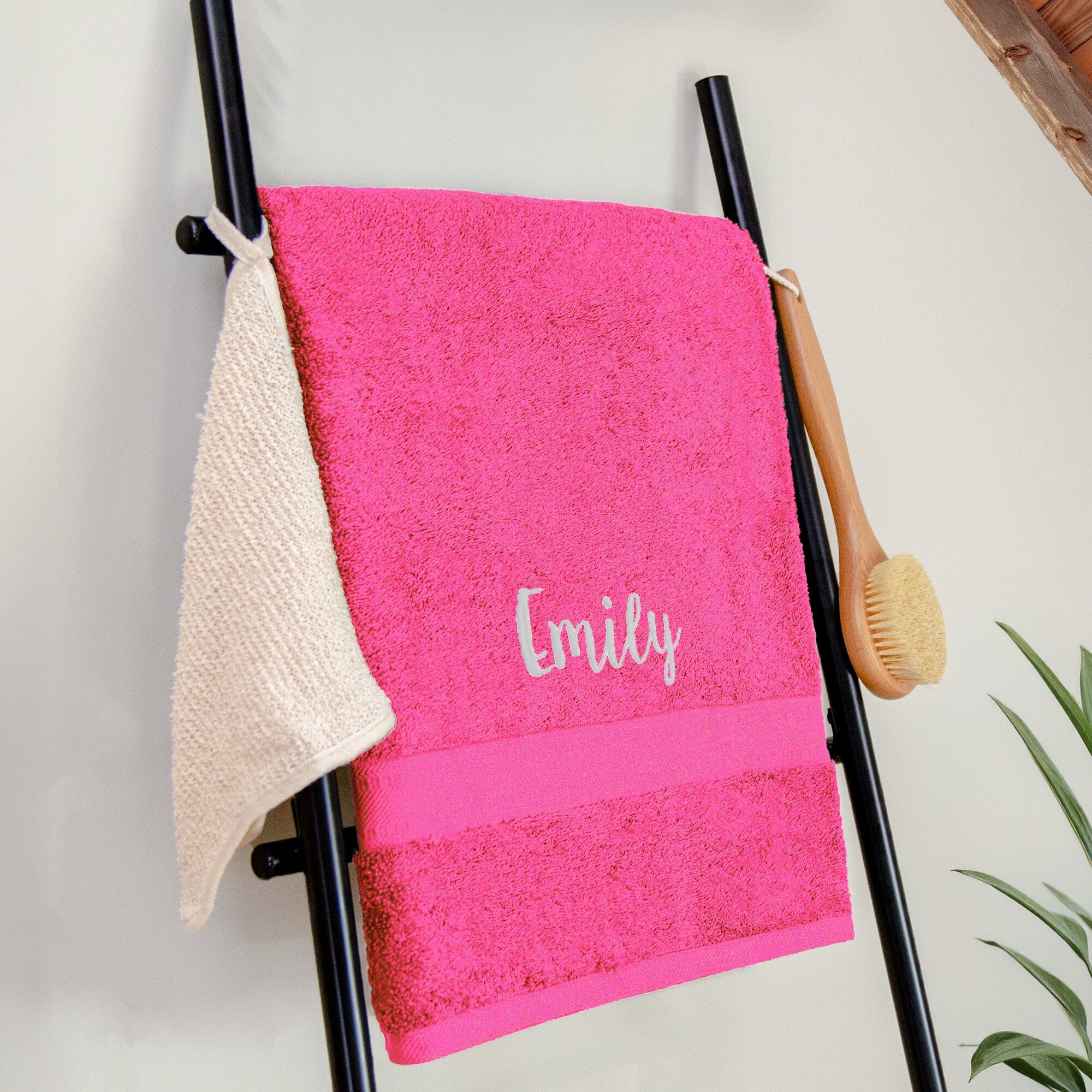 Name on a pink bath sheet