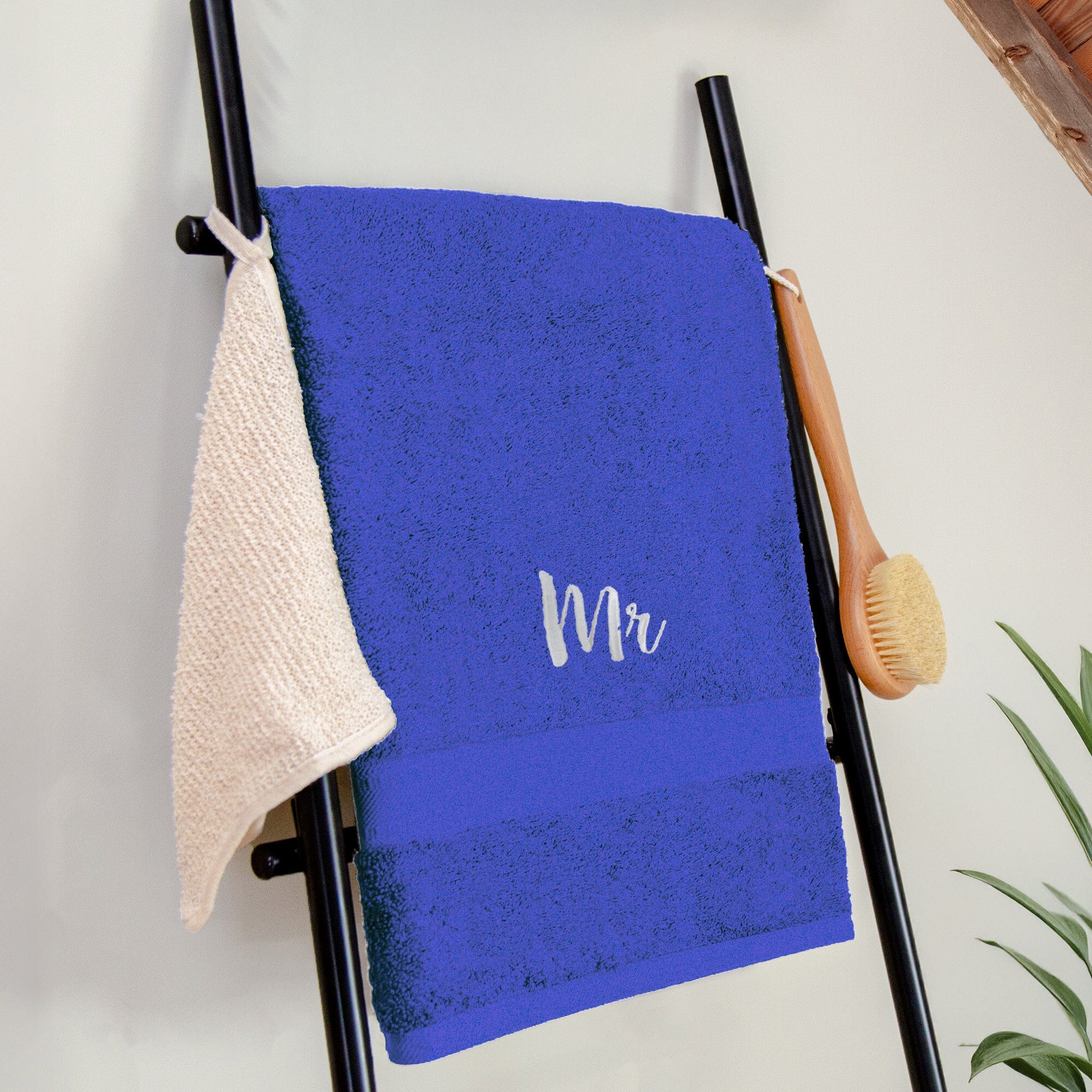 Name on a royal blue bath sheet