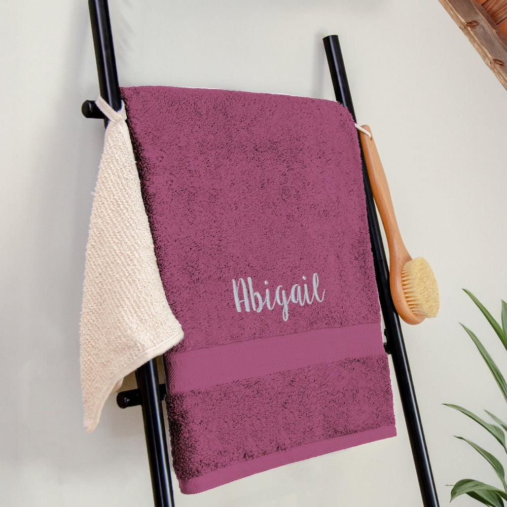 Name on a purple bath sheet