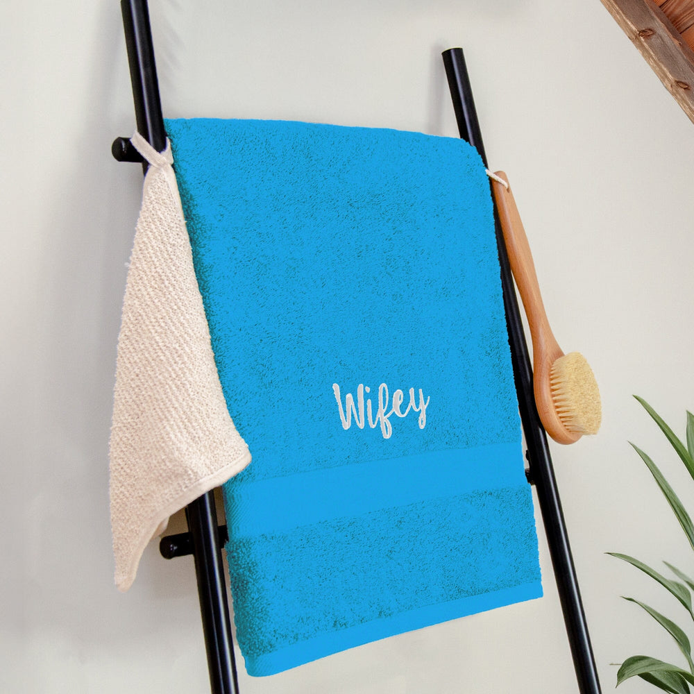 Name on a turquoise blue bath sheet