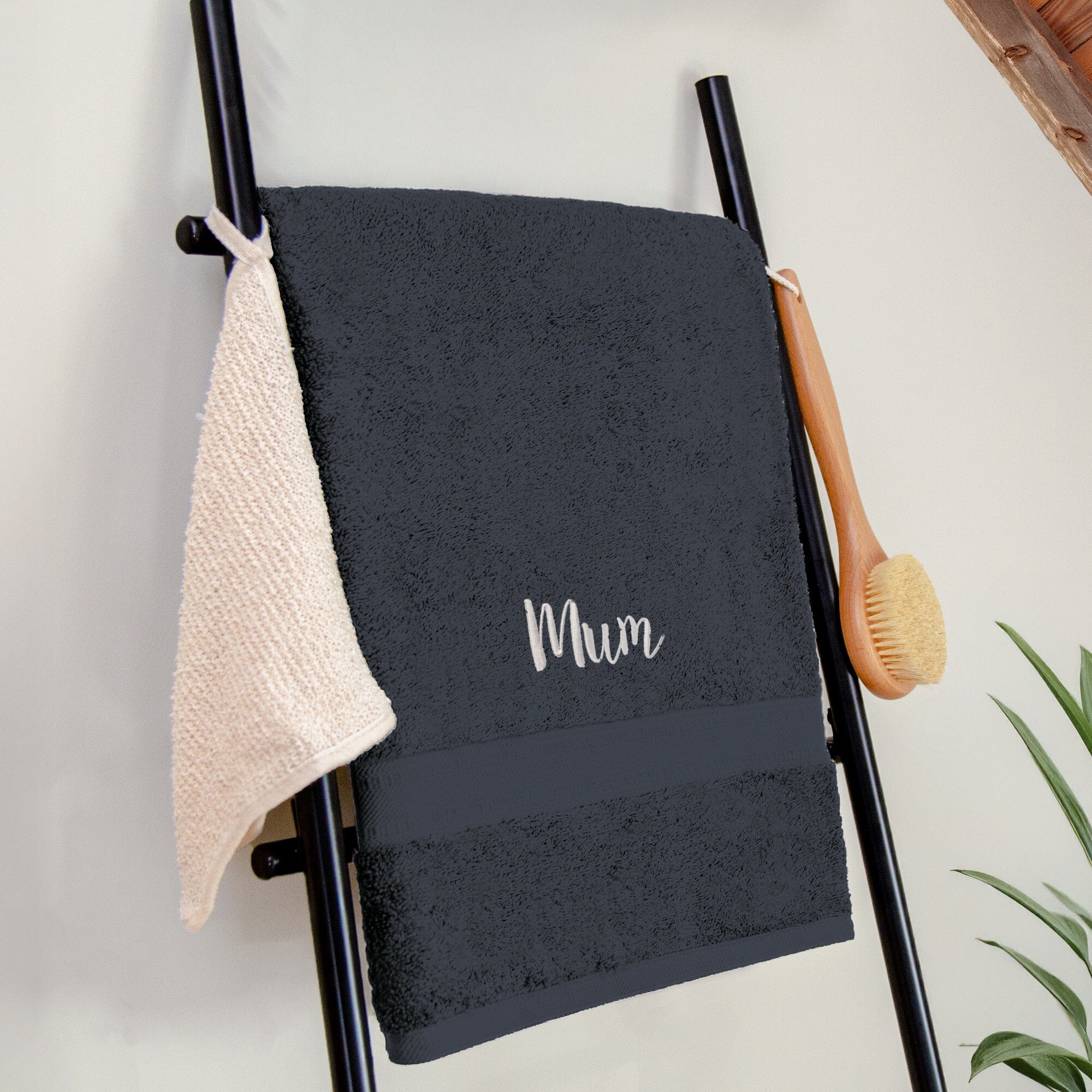 Name on a black bath sheet