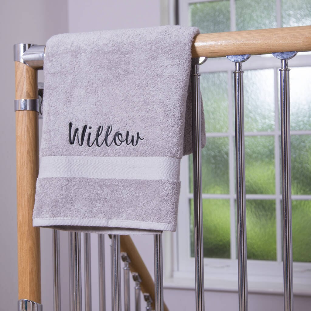 Silver towel with black text