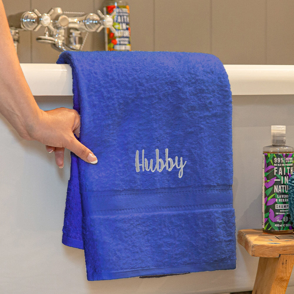 Name on a royal blue bath towel