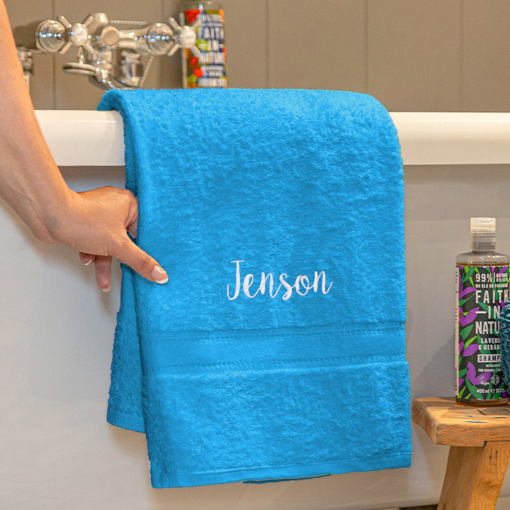 Name on a turquoise blue bath towel