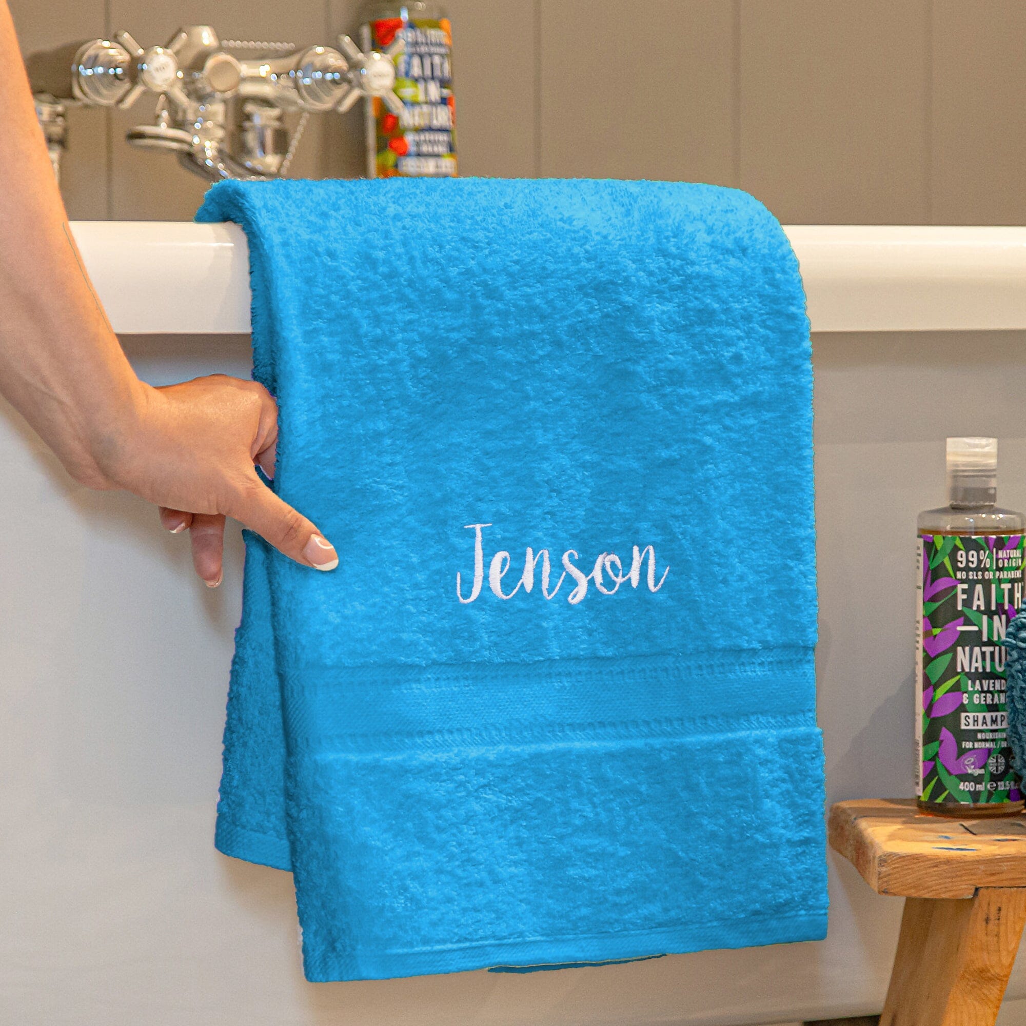 Name on a turquoise blue bath towel