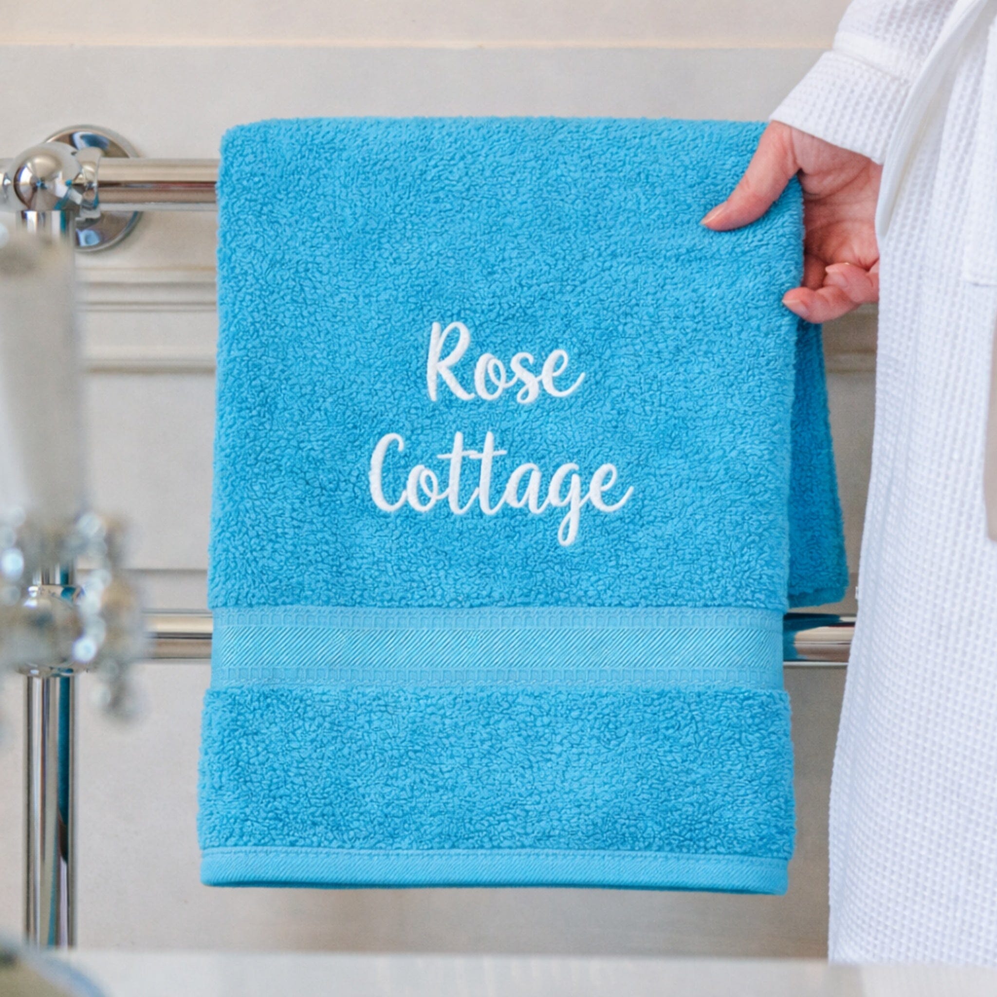 name on turquoise hand towel