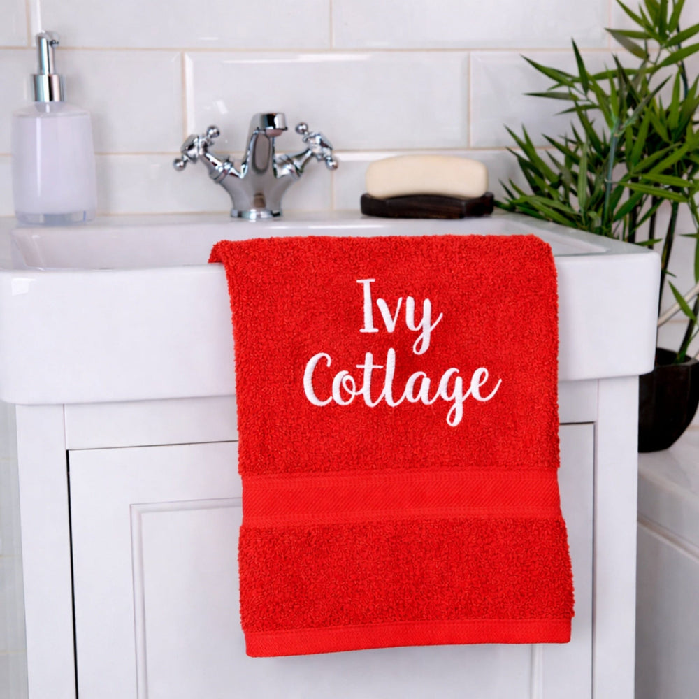 name on red hand towel